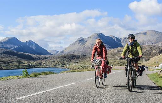 Harris: cyclists at Ardhasaig with Clisham backdrop