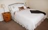 Lily Pond Cottage white bed
