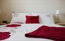 Lily Pond Cottage red & white bed