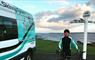 Skinny Tyres Ltd van & cyclist at John o' Groats