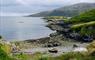 Gatliff Hebridean Hostel - Rhenigidale small boat on stoney beach