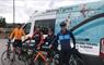 Skinny Tyres Ltd 4 cyclists at van