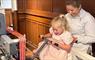 The Harris Tweed® Story Room mum and little girl at a loom