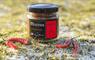 Jar of mustard in a wintery landscape with Chillis