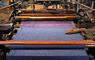 The Harris Tweed® Story Room blue tweed in a loom