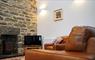 Creagan Glas Cottage tv lounge with stove