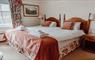 A cosy hotel room featuring a comfortable bed and a window offering a scenic view.